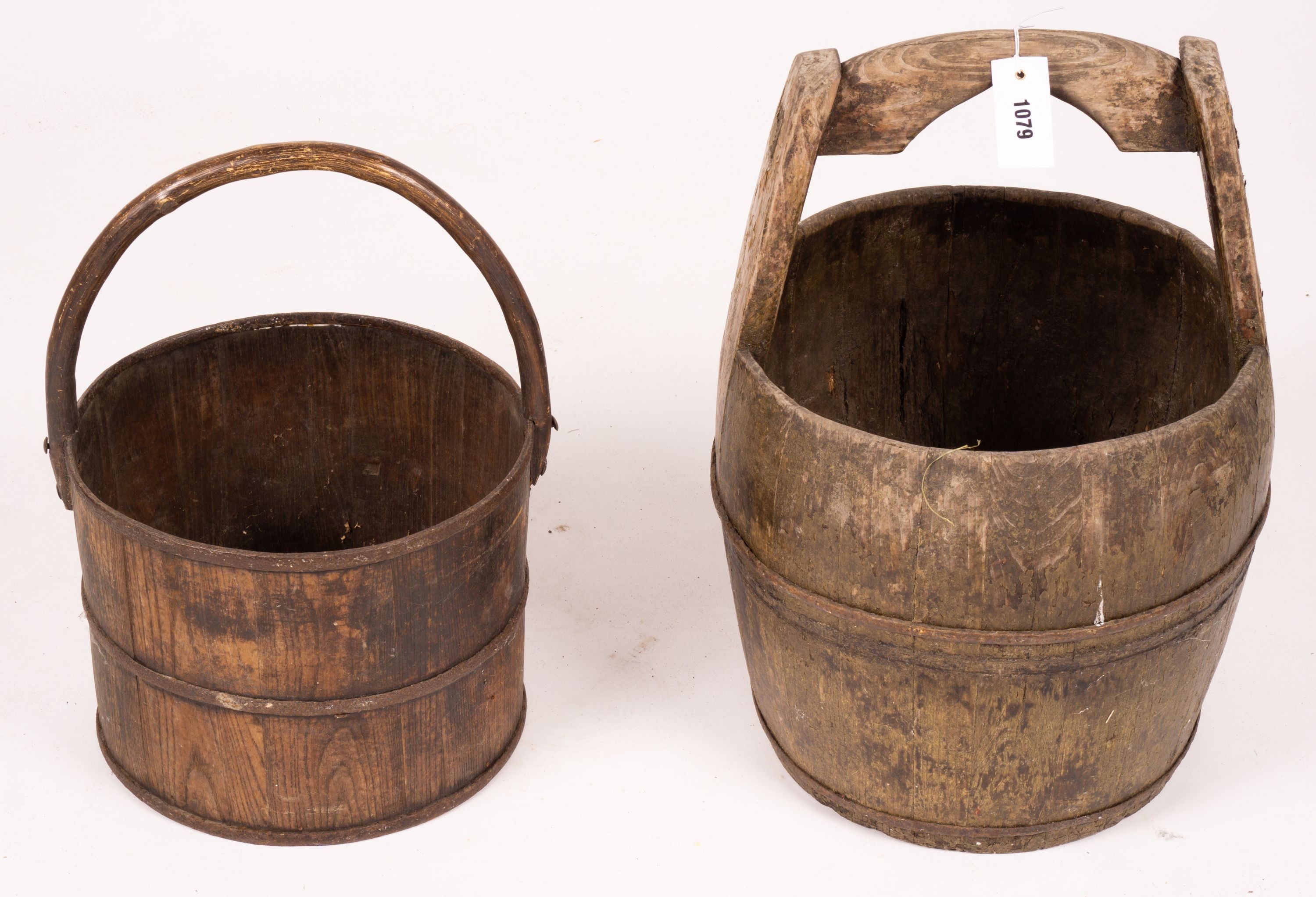 A Chinese staved wood rice carrier together with a circular iron bound staved wood bucket, larger 35cm diameter, height 52cm